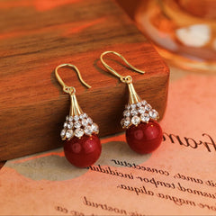 Model showcasing the dangle and style of the 14K Gold-Plated Zircon Diamond Pearl Ear Hook Earrings