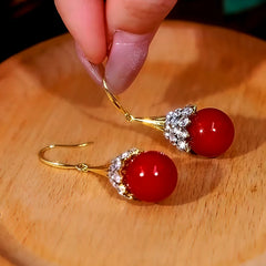 Angled view of the 14K Gold-Plated Zircon Diamond Pearl Ear Hook Earrings
