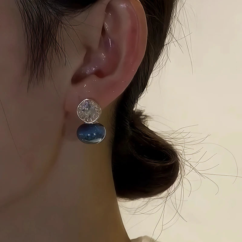 Model showcasing the dangle and style of the 14K Gold-Plated Zircon Diamond Pearl Earrings