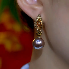 Close-up detail of the sparkling zircons and plating on the Brown Pearl Earrings