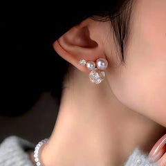 Model showcasing the dangle and style of the 14K Gold-Plated Zircon Diamond Pearl Flower Earrings