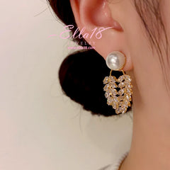 Close-up detail of the sparkling zircons and plating on the Pearl Leaf Earrings
