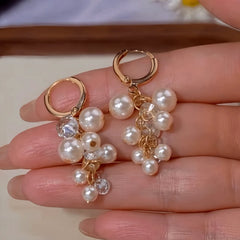 Angled view of the 14K Gold-Plated Zircon Diamond Pearl Tassel Earrings
