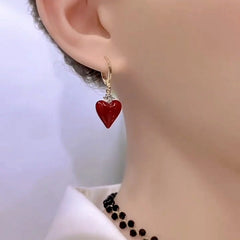 Close-up detail of the sparkling zircons and plating on the Red Heart Earrings