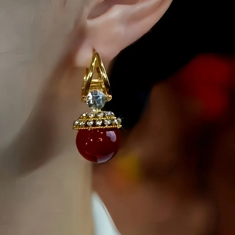 Close-up detail of the sparkling zircons and plating on the Bow Pearl Earrings