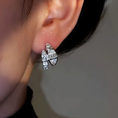 Close-up detail of the sparkling zircons and plating on the Snake Shaped Earrings