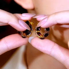 Angled view of the 14K Gold-Plated Zircon Diamond Sunflower Hoop Earrings