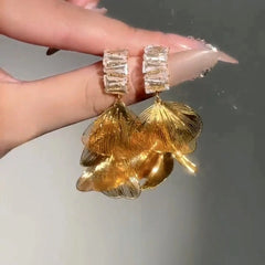 Model showcasing the dangle and style of the 14K Gold-Plated Zircon Diamond Tassel Earrings