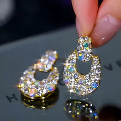 Angled view of the 14K Gold-Plated Zircon Diamond Tassel Earrings