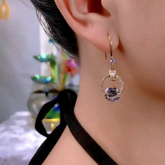 Model showcasing the dangle and style of the 14K Gold-Plated Zircon Diamond Water Drop Ear Hook Earrings