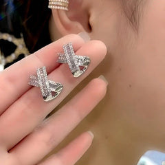 Close-up detail of the sparkling zircons and plating on the X-Shaped Studs