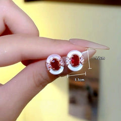 Model showcasing the dangle and style of the 14K Gold-Plated Zircon Dimond Lady Windsor Stud Earrings