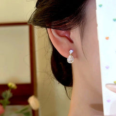Model showcasing the dangle and style of the 14K Gold-Plated Zircon Dimond Water Drop Earrings
