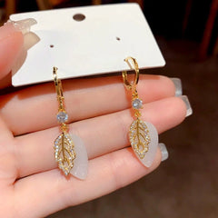 Model showcasing the dangle and style of the 14K Gold-Plated Zircon Double-Layer Leaf Earrings
