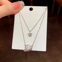 Detailed view of the 14K Gold-Plated Zircon Double-Layer Star And Moon Necklace chain and pendant