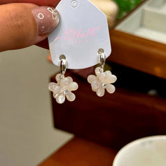Angled view of the 14K Gold-Plated Zircon Double-Sided Flower Earrings