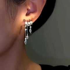 Model showcasing the dangle and style of the 14K Gold-Plated Zircon Drop Pearl Tassel Earrings