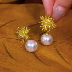 Model showcasing the dangle and style of the 14K Gold-Plated Zircon Firework Pearl Earrings