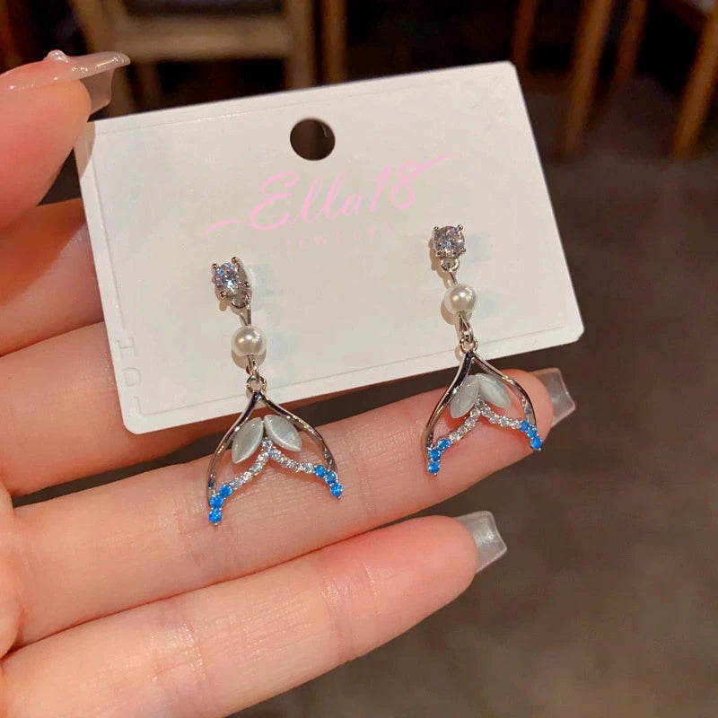 Styling the Fishtail Pearl Earrings for a chic and modern look