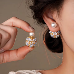 Model showcasing the dangle and style of the 14K Gold-Plated Zircon Flower Bead Jacket Earrings