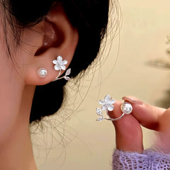 Angled view of the 14K Gold-Plated Zircon Flower Bead Jacket Earrings