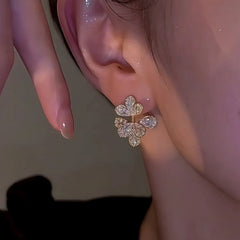 Close-up detail of the sparkling zircons and plating on the Hollow Flower Earrings