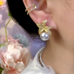 Close-up detail of the sparkling zircons and plating on the Asymmetrical Flower Pearl