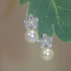 Angled view of the 14K Gold-Plated Zircon Flower Pearl Earrings