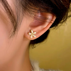 Angled view of the 14K Gold-Plated Zircon Flower Tassel Earrings