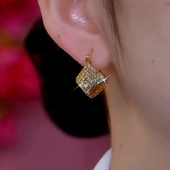 Model showcasing the dangle and style of the 14K Gold-Plated Zircon Geometric Double-Sided Diamond Earrings