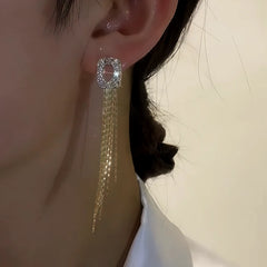 Close-up detail of the sparkling zircons and plating on the Geometric Tassel Earrings