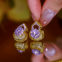 Angled view of the 14K Gold-Plated Zircon Gourd Good Luck Earrings
