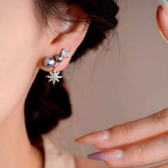 Close-up detail of the sparkling zircons and plating on the Gray Pearl Star