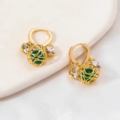Angled view of the 14K Gold-Plated Zircon Green Crystal Ball White Diamond Earrings
