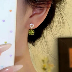 Angled view of the 14K Gold-Plated Zircon Green Diamond Water Drop Earrings