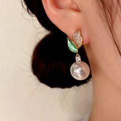 Close-up detail of the sparkling zircons and plating on the Green Leaf Pearl