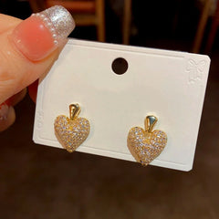 Angled view of the 14K Gold-Plated Zircon Heart Earrings