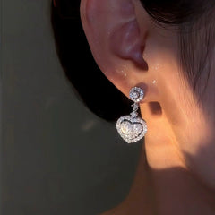 Close-up detail of the sparkling zircons and plating on the Silver Heart Charm