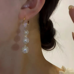 Close-up detail of the sparkling zircons and plating on the Heart Pearl Tassel