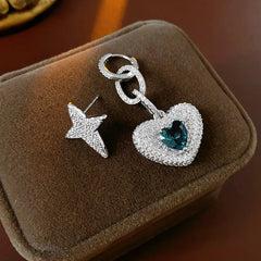Model showcasing the dangle and style of the 14K Gold-Plated Zircon Heart Star Asymmetrical Earrings