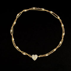 Detailed view of the 14K Gold-Plated Zircon Heart To Heart Magnetic Necklace chain and pendant