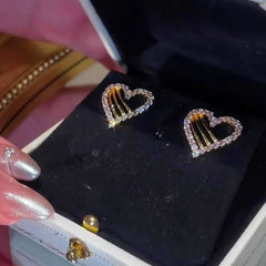 Angled view of the 14K Gold-Plated Zircon Hollow Heart Earrings