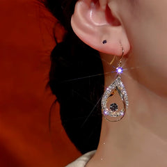 Close-up detail of the sparkling zircons and plating on the Hollow Teardrop Ear Hooks