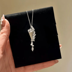 Close-up of the pendant and clasp on the Sparkling Hourglass Necklace