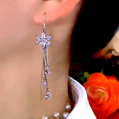 Model showcasing the dangle and style of the 14K Gold-Plated Zircon Ice Flower Tassel Earrings