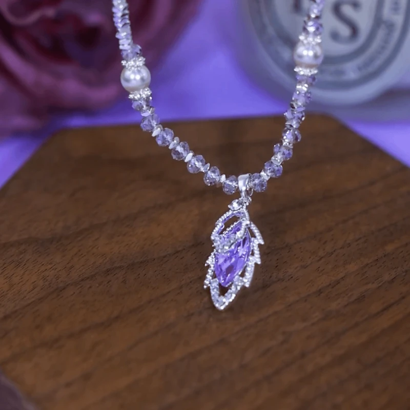 Detailed view of the 14K Gold-Plated Zircon Jade Leaf Pendant Necklace chain and pendant