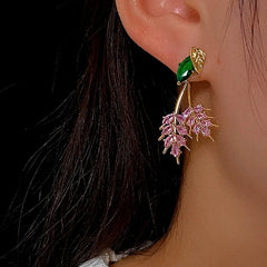 Model showcasing the dangle and style of the 14K Gold-Plated Zircon Leaf Earrings