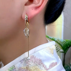 Close-up detail of the sparkling zircons and plating on the Curved Leaf Pearl