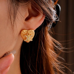 Close-up detail of the sparkling zircons and plating on the M Initial Studs