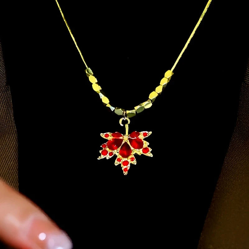 Detailed view of the 14K Gold-Plated Zircon Maple Leaf Necklaces chain and pendant